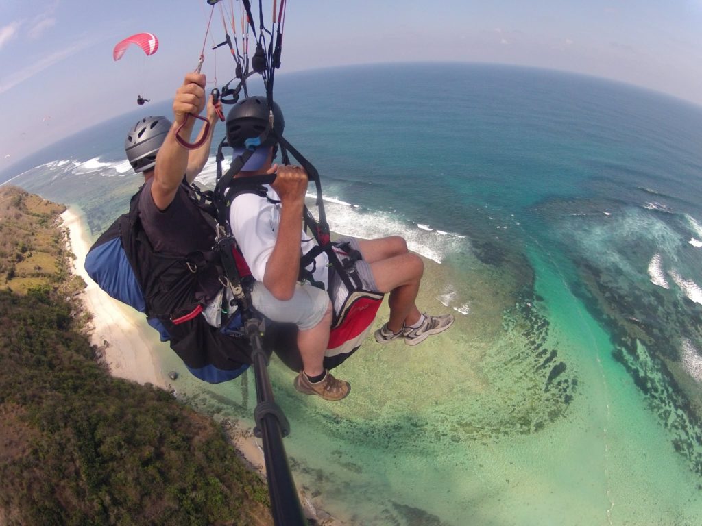 Tandem paragliding over the Uluwatu cliffs